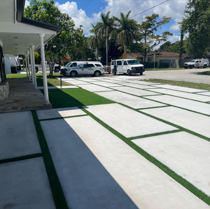 Wide concrete driveway with decorative bands in Hialeah FL