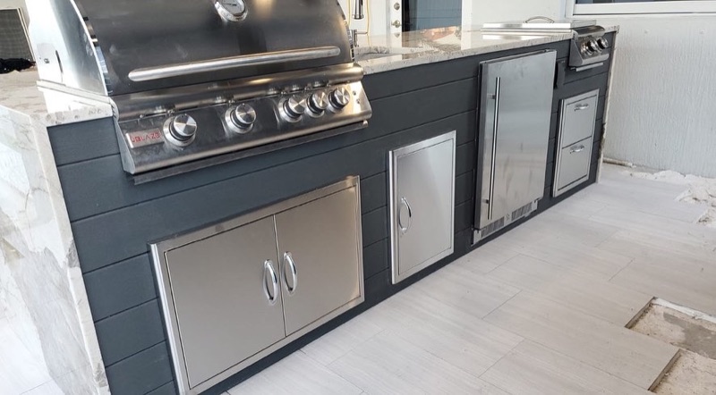 Custom outdoor kitchen with grill and stone countertops in Miami-Dade FL