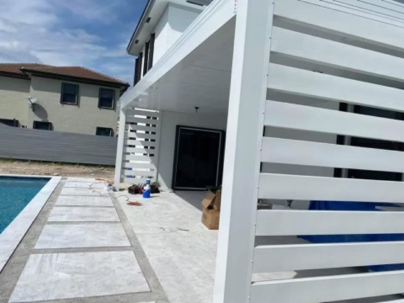 Backyard pergola over an outdoor living area in Hollywood FL