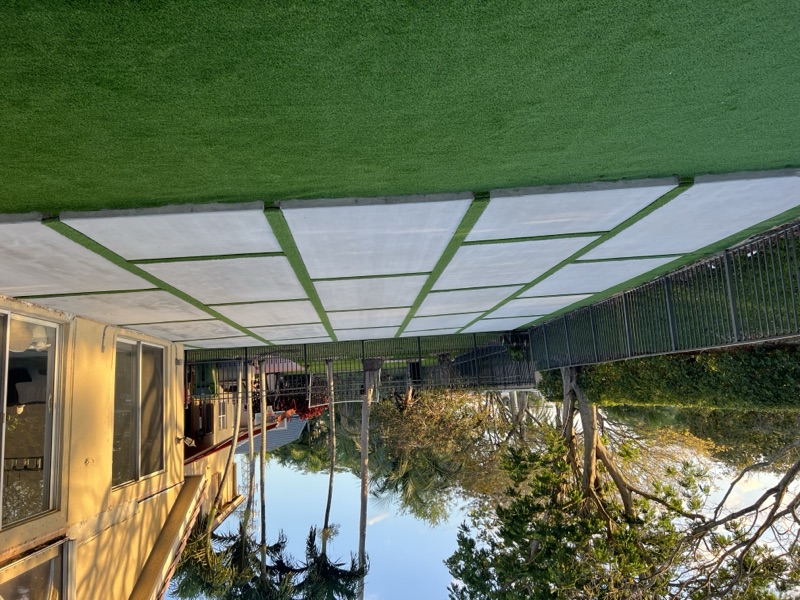 Artificial turf with decorative concrete strips in Hollywood FL